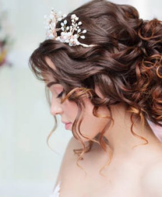 Portrait of a beautiful girl in a wedding dress. Bride in luxurious dress, close-up
